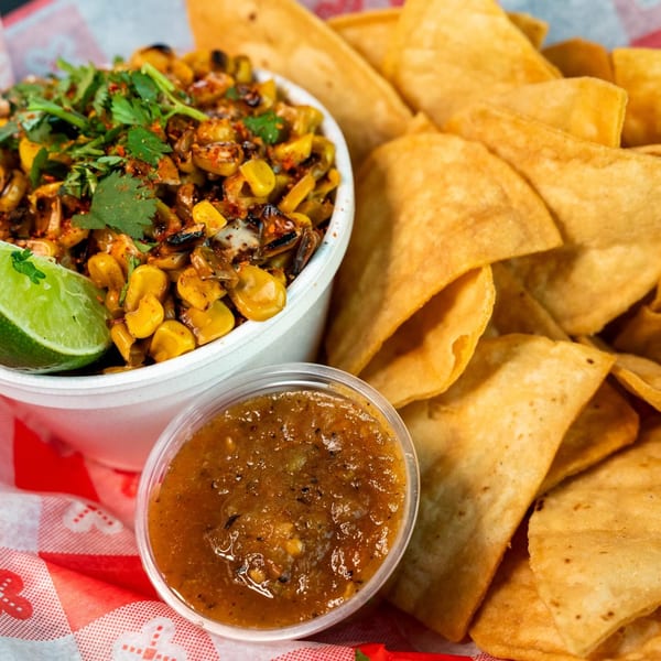 Elote street corn with cilantro, lime, and a side of salsa and tortilla chips from The Blacktop Grill.