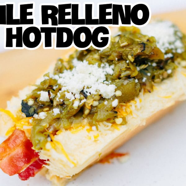 A Blacktop Grill Chile Relleno Hotdog, topped with green chile, cheese, and cotija.