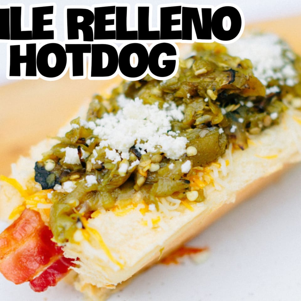 A Blacktop Grill Chile Relleno Hotdog, topped with green chile, cheese, and cotija.
